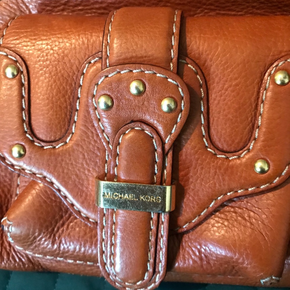 A vintage Micheal Kors handbag.